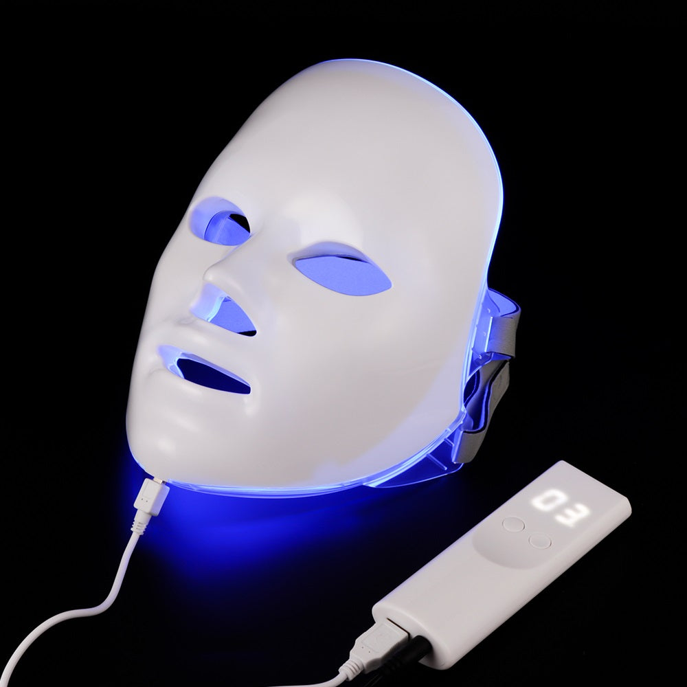 LED face mask in blue light mode for acne treatment